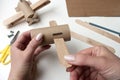 How to make airplane. Hand made toy,zero waste from toilet paper roll and popsicle sticks. For kids and parents. Step 4, first try Royalty Free Stock Photo