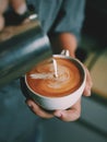 How to make coffee latte art by barista in vintage color tone Royalty Free Stock Photo