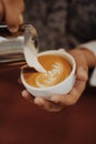 How to make coffee latte art by barista in vintage color tone Royalty Free Stock Photo