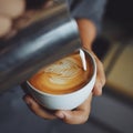 How to make coffee latte art by barista in vintage color tone Royalty Free Stock Photo