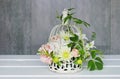 How to make floral arrangement with roses, dahlias and iris flowers inside a vintage bird cage