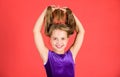 How to make tidy hairstyle for kid. Ballroom latin dance hairstyles. Kid girl with long hair wear dress on red