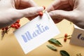 How to make wedding place name cards with handwritten letters and fresh plants