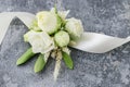 How to make wrist corsage for bride using rose and eustoma flowers Royalty Free Stock Photo