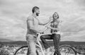 How to meet girls while riding bike. Man with beard and shy blonde lady on first date. Couple just meet to become Royalty Free Stock Photo