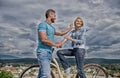 How to meet girls while riding bike. Man with beard and shy blonde lady on first date. Couple just meet to become Royalty Free Stock Photo