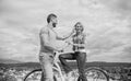 How to meet girls while riding bike. Man with beard and shy blonde lady on first date. Picking up girl. Couple just meet Royalty Free Stock Photo