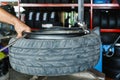 How to remove the tire from the car Alloy Wheels. Royalty Free Stock Photo