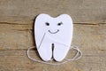 How to sew a felt tooth fairy. Step. Instruction for kids. Join the felt edges of felt tooth fairy with white thread. Vintage wood