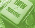 How to survive words on cover of copybook, glasses and pen. Surcvival concept. Crisis management business concept Royalty Free Stock Photo