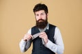 How to tie simple knot. Man bearded hipster try to make knot. Different ways of tying necktie knots. Art of manliness