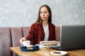 How to work more productively. Young woman student, freelancer working with laptop Royalty Free Stock Photo