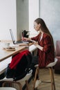 How to work more productively. Young woman student, freelancer working with laptop Royalty Free Stock Photo