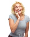 Howd you know. Studio shot of a beautiful young woman looking surprised isolated on white.