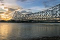 Howrah Bridge on the river Ganges (also known as the river Hooghly) at sunset. Photograph taken from Mallick ghat.