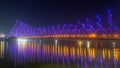 Howrah bridge selective focus - The historic cantilever bridge on the river Hooghly lit with purple and yellow lights Royalty Free Stock Photo