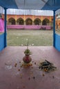 Howrah, India -October 26th, 2020 : Sacred Mangal ghot worshipped with green coconut on it, at far Goddess Durga is being Royalty Free Stock Photo