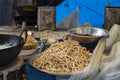 Howrah, West Bengal, India - 26.10.2020 : Nimki, Indian fast food snack is being prepared for sale. Durga Puja festival brings in