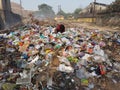 Pollution from city garbage, a poor man hunting food from garbage at Howrah baghar dumping ground. Royalty Free Stock Photo