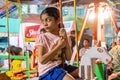 Children riding nagordola - charak or gajan festival