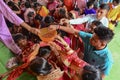 Howrah, West Bengal, India - 14th October 2021 : Hindu devotees putting coins in basket for pushpanjali puja to Goddess Durga,