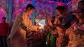 Howrah, West Bengal, India - 5th October, 2022 : Hindu devotees sharing divine blessings of Goddess Durga from flame of fire of