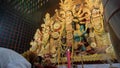 Howrah,West Bengal,India-5th October, 2022 : Hindu Purohit showing respect, praying and worshipping Goddess Durga, kneels down