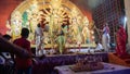 Howrah, West Bengal, India - 5th October, 2022 : Hindu Purohits offering Vog, holy sweet food to Goddess Durga while Dhaakis