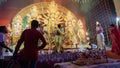 Howrah, West Bengal, India - 5th October, 2022 : Hindu Purohits offering Vog, holy sweet food to Goddess Durga while Dhaakis