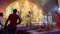 Howrah, West Bengal, India - 5th October, 2022 : Hindu Purohits offering Vog, holy sweet food to Goddess Durga while Dhaakis