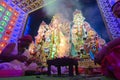 Hindu purohits raising holy fire of yajna to worship Goddess Durga, in side Durga