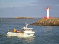 Howth Lighthouse. Fishing boat on Irish sea