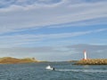 Howth Lighthouse. Fishing boat on Irish sea