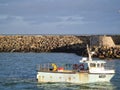 Howth Lighthouse. Fishing boat on Irish sea