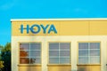 Hoya sign, logo on the facade of Hoya Corporationy manufacturing optical products - Milpitas, California, USA - Royalty Free Stock Photo