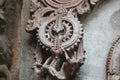 Hoysaleswara Temple outside wall carved with sculpture resembling mechanical gear
