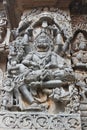 Hoysaleswara Temple wall carved with sculpture of Lord Narasimha Lion faced hindu god killing the demon king