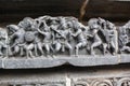 Hoysaleswara Temple wall carved with sculpture of warriors and ancient battle scene