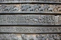 Hoysalesware Temple Wall carved with sculptures of warriors and makara mythical animal