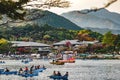 Tourists and locals row their rented boats at the hozugawa river