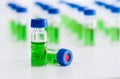 HPLC vials with green sample of plant extracts. Developing of drugs based on natural products. Biochemical analysis Royalty Free Stock Photo
