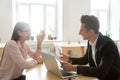 Hr and applicant talking laughing at job interview, good impress Royalty Free Stock Photo