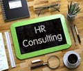 HR Consulting Handwritten on Small Chalkboard. 3D. Royalty Free Stock Photo