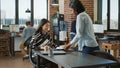 HR employee greeting female applicant at job interview