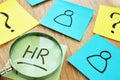 HR human resource written on a stick and magnifier. Royalty Free Stock Photo