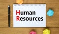 HR Human resources symbol. Concept words HR Human resources on white note. Metallic pen. Beautiful wooden background. Business and Royalty Free Stock Photo