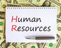 HR Human resources symbol. Concept words HR Human resources on white note. Metallic pen. Dollar bills. Beautiful white background Royalty Free Stock Photo