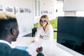 HR manager interviewing young woman in modern office Royalty Free Stock Photo