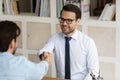 Hr manager shaking smiling businessman hand, congratulating successful candidate