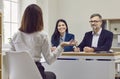 HR managers listening to a candidate while sitting at a desk during a job interview Royalty Free Stock Photo